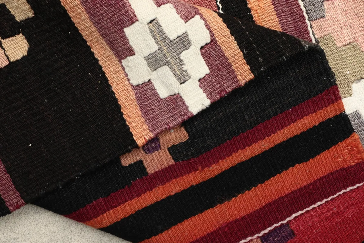 Underside view of the hand-knotted cotton foundation and wool pile construction
