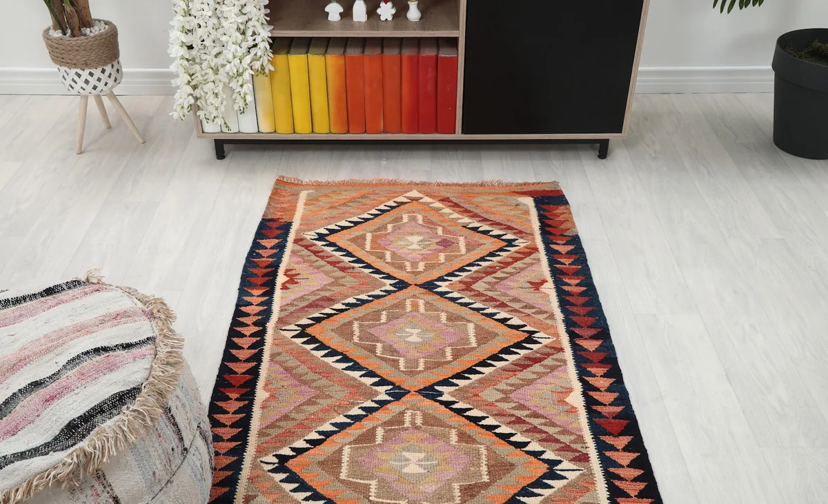 View of the runner rug extending down a hallway in a home decor setting