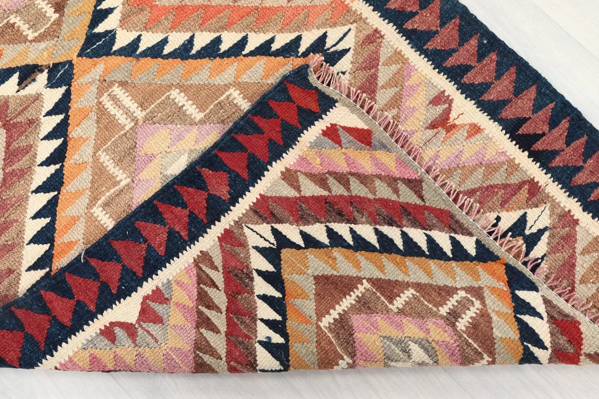 View of the back of the hand-knotted runner rug, showing craftsmanship