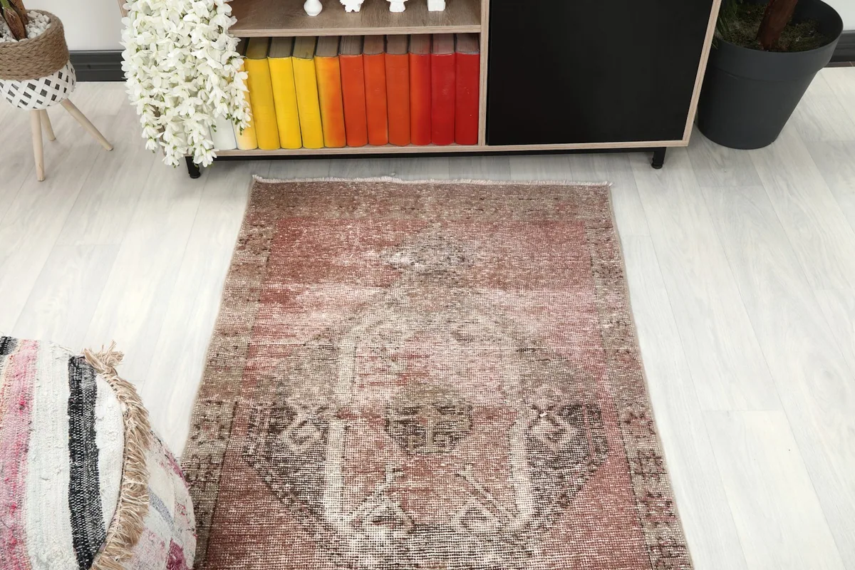 Overhead view focusing on one end of the runner rug, displaying its main patterns