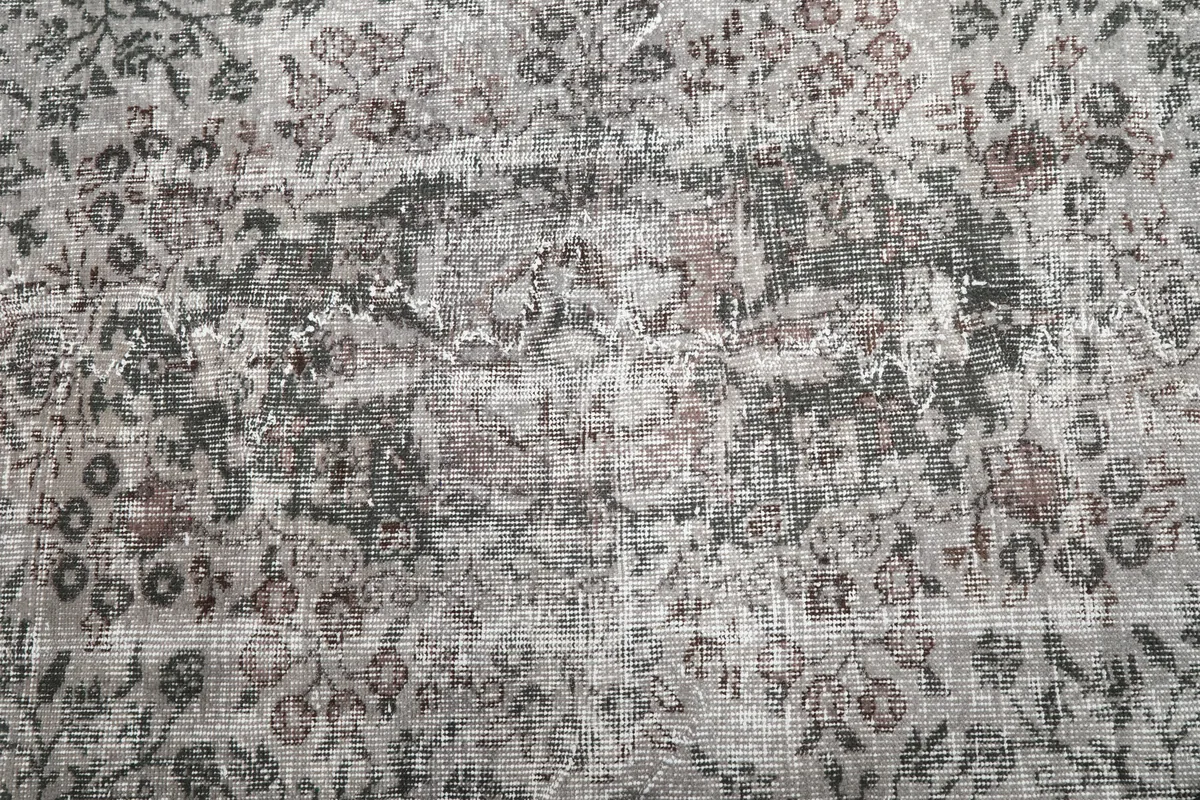 Close-up of the Rose Gray Medallion Rug's intricate floral motifs and texture