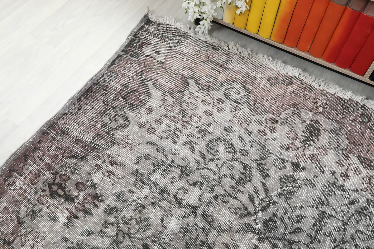Rose Gray Medallion Rug from a corner angle, highlighting the border design