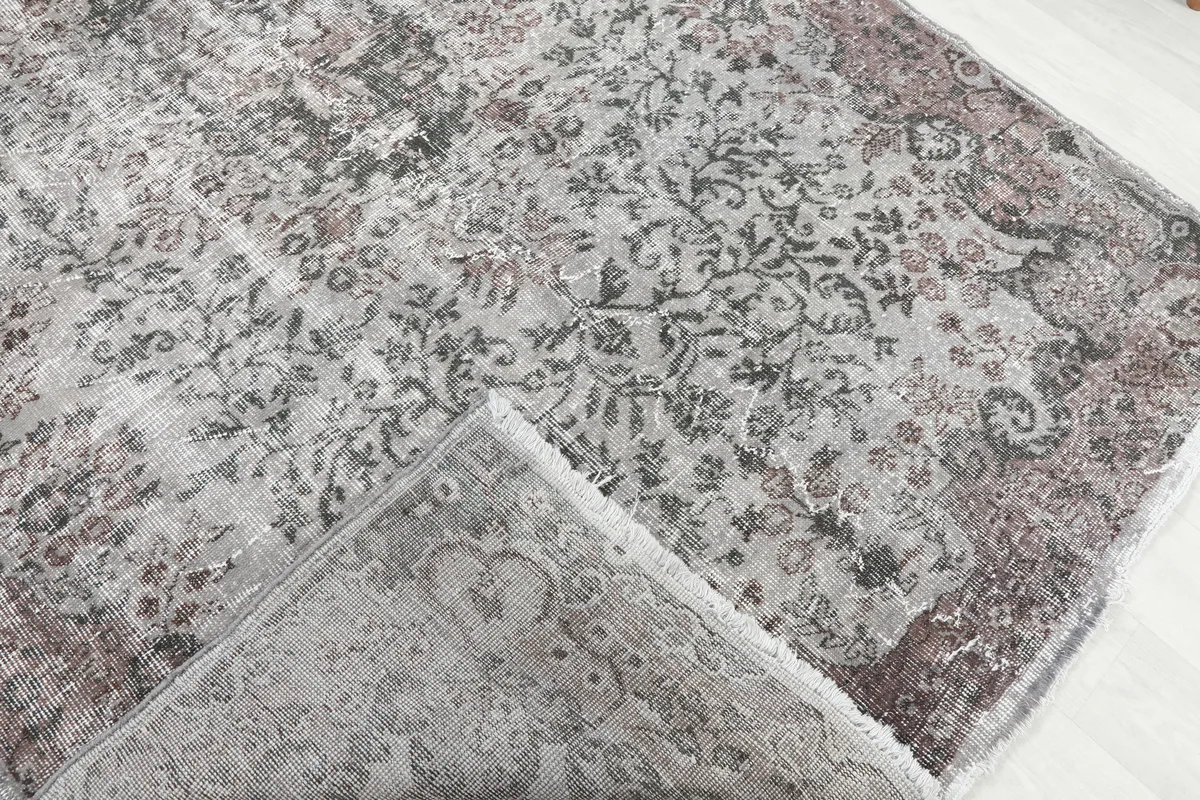 Rose Gray Medallion Rug showing the backside and hand-knotted construction