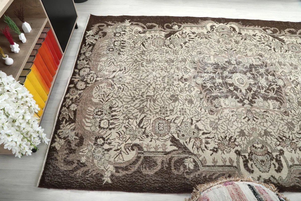 Angled view of the rug, emphasizing its texture and distressed appearance