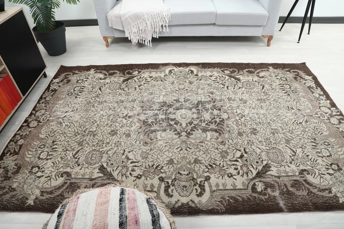 Wide shot of the rug placed in a room, showing its full scale