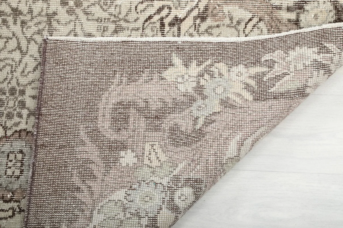 Close-up of the back of the hand-knotted rug, showing the weave