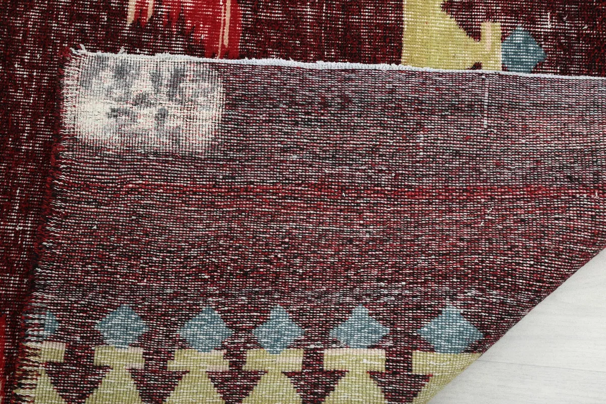 Underside of the rug, highlighting the wool pile on cotton foundation and construction