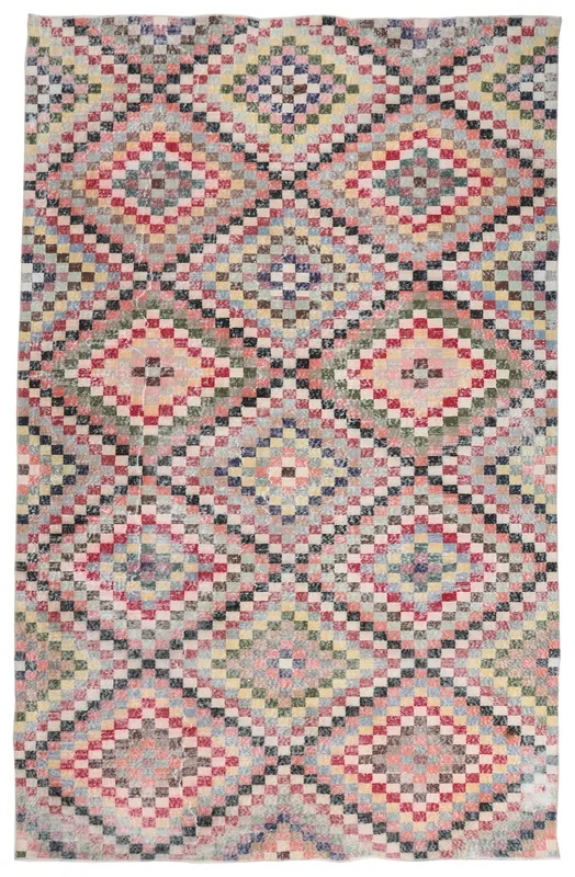 Full top view of the 6'8" x 10'4" multicolor geometric vintage Anatolian area rug on a white background.