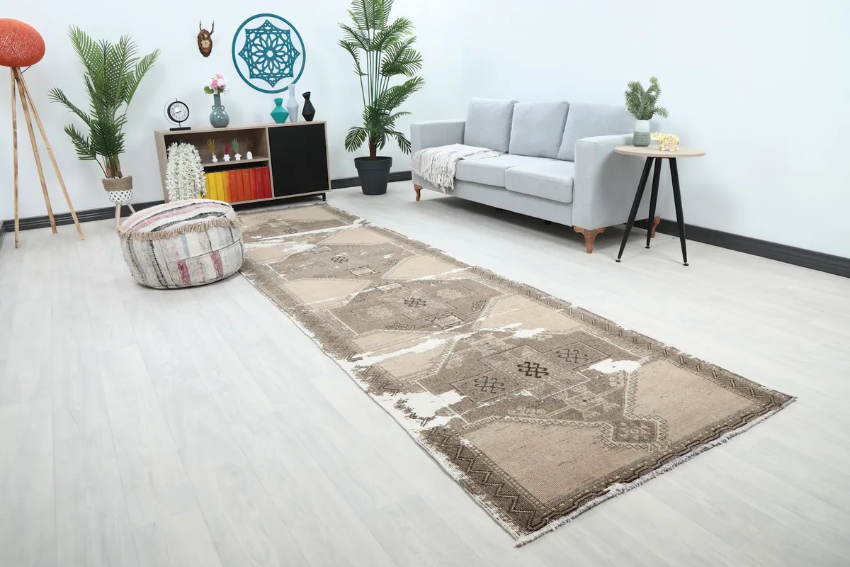 Long view of the vintage runner rug extending through a modern living space