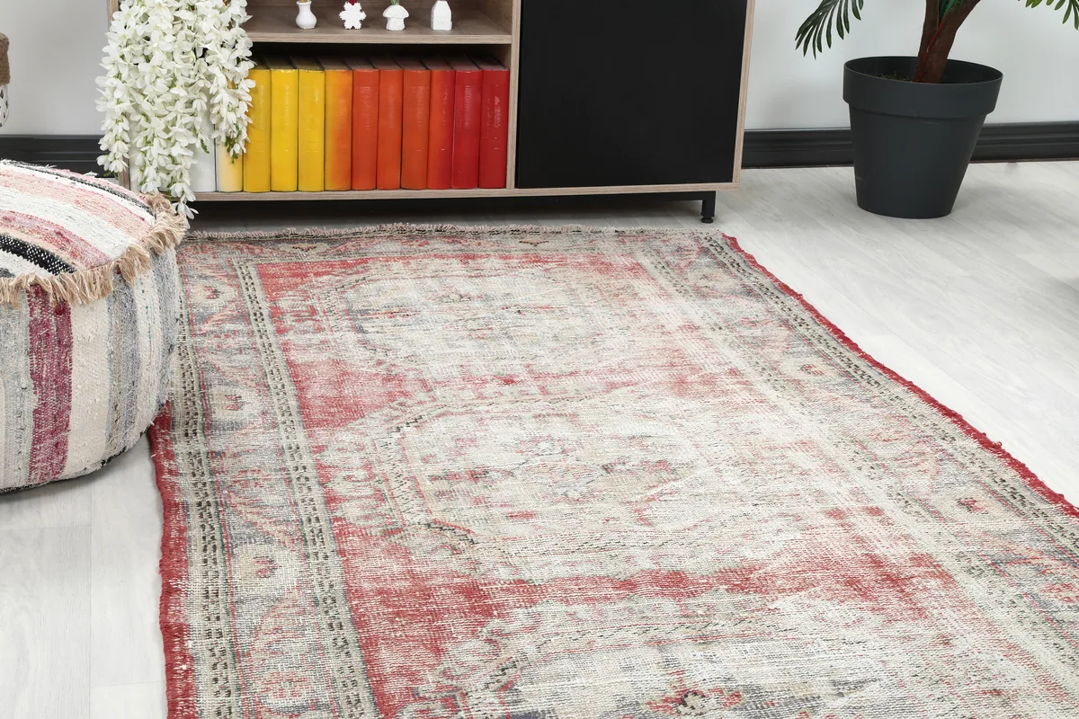 Close-up view of the Faded Red Geometric Anatolian Runner in a room setting