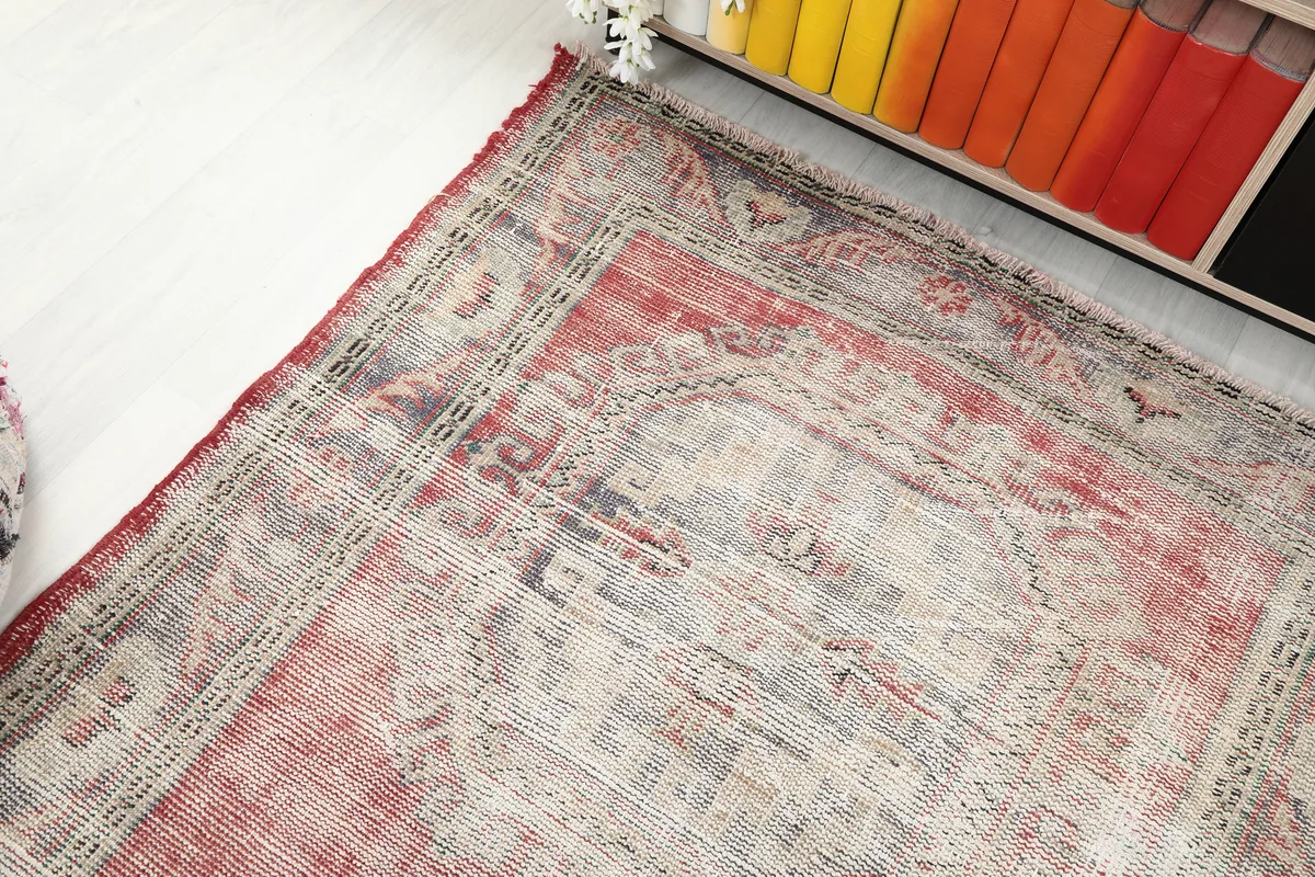 Overhead angled view of the Faded Red Geometric Anatolian Runner's design