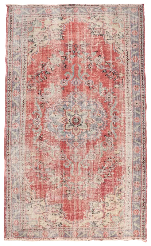 Full overhead view of the hand-knotted vintage Anatolian area rug with a distressed red field