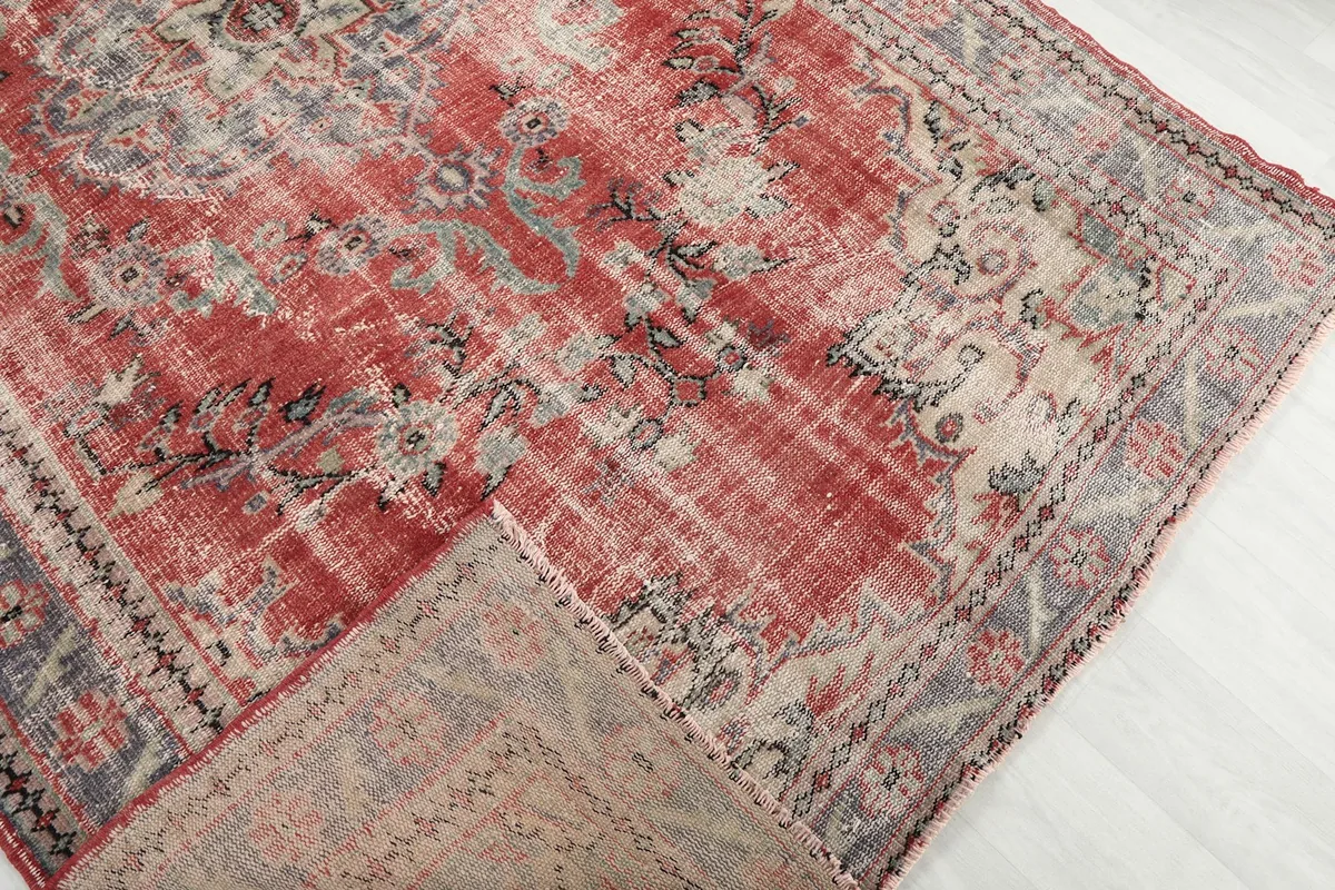 View of the rug folded back, showing the wool pile on the cotton foundation