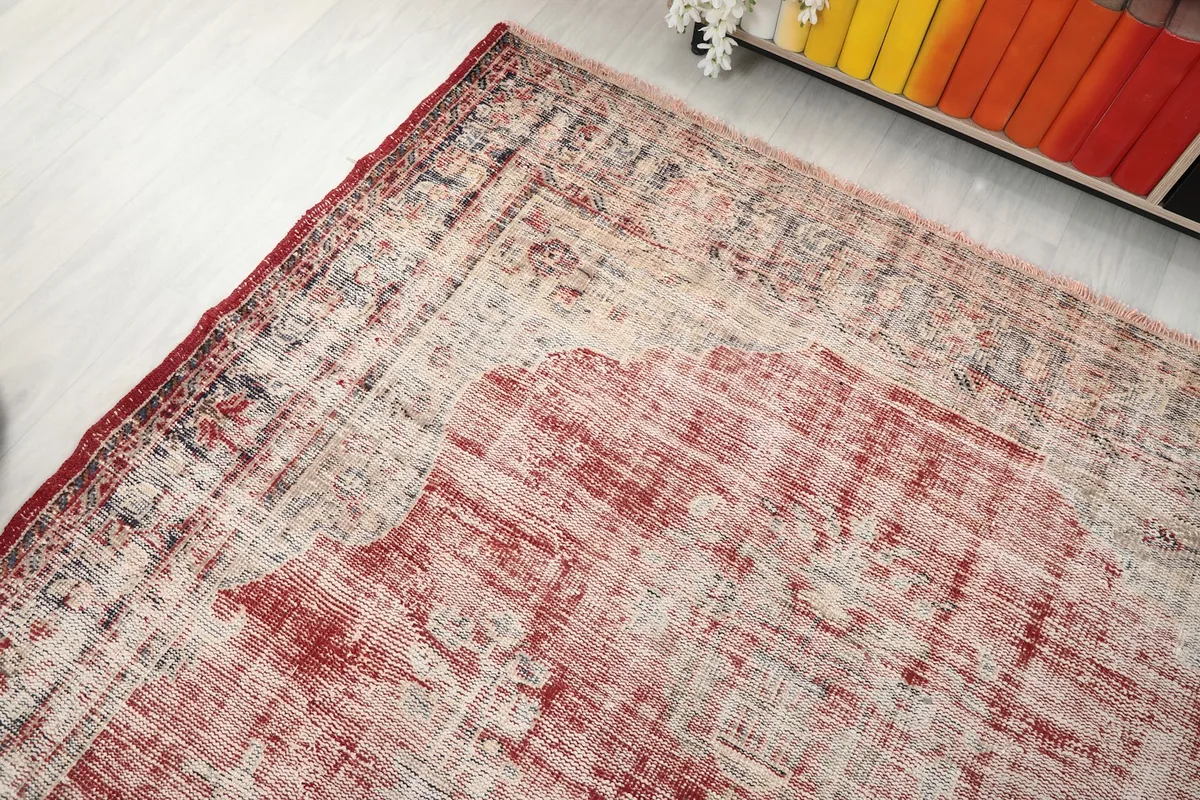 Overhead corner view of the rug, showcasing the distressed texture and color variation