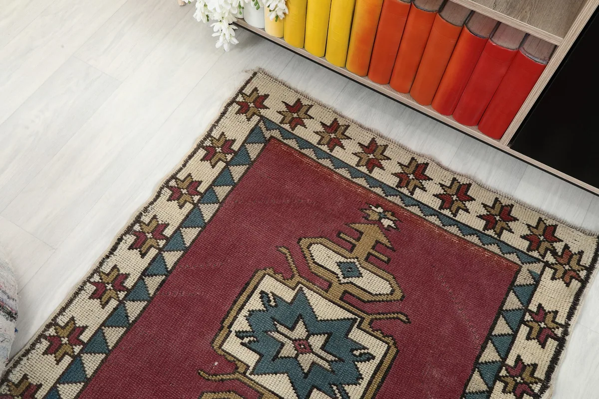 Overhead angle view of the runner rug in a room, showing part of the rug near a bookshelf