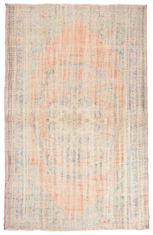 Full top view of a large vintage Anatolian rug with a central medallion in rust, blue, and beige tones.