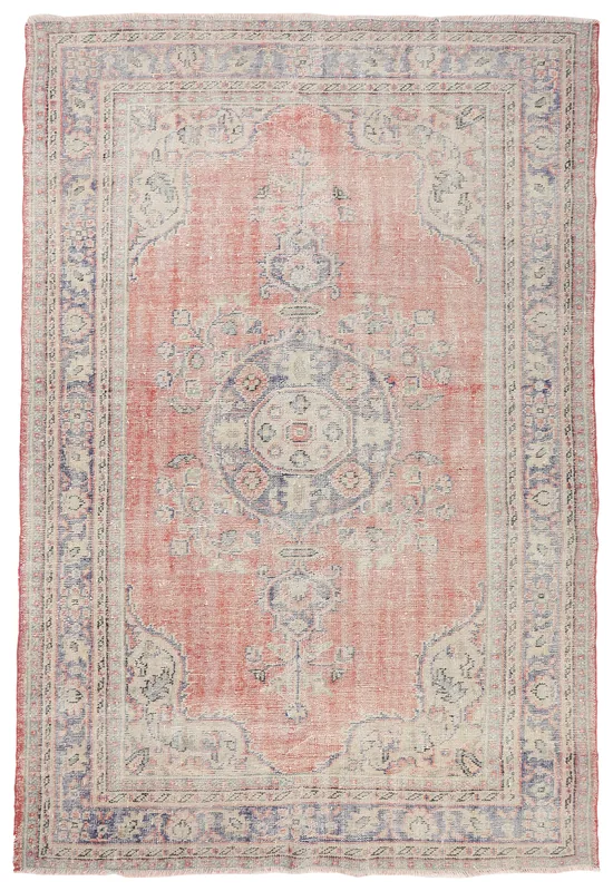 Full overhead view of a vintage rose beige Anatolian medallion rug