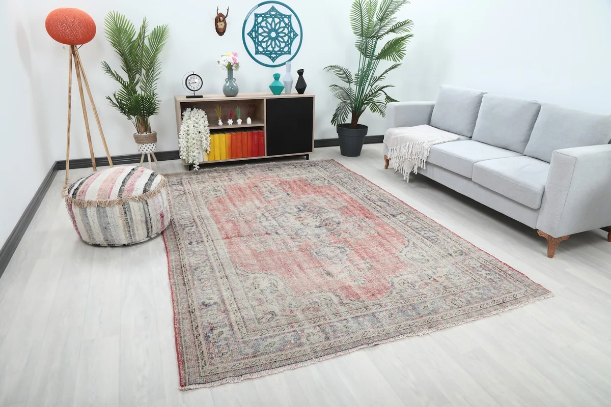 Angle view of the rose beige vintage rug in a home decor setting