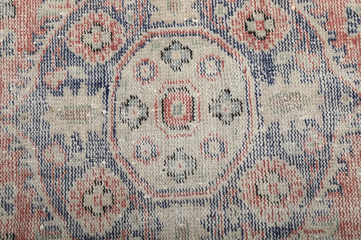 Close-up showing the intricate geometric patterns within the medallion and blue sections