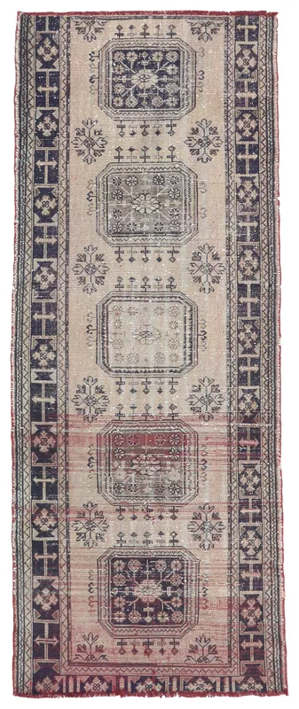 Full overhead view of the beige and navy geometric vintage Anatolian rug