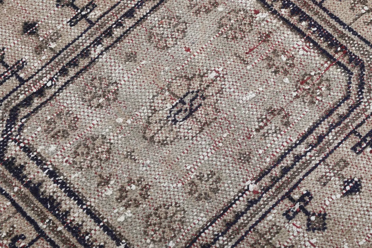 Extreme close-up of the low wool pile, showing texture and individual knots