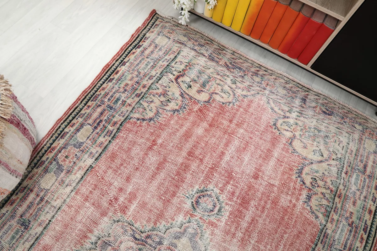 Overhead angle view capturing the rug's overall pattern and texture in a room setting.