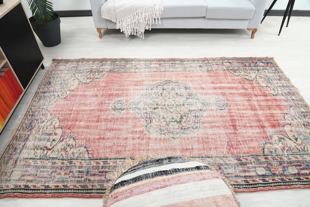 Wide room shot demonstrating the rug's medium size relative to furniture.