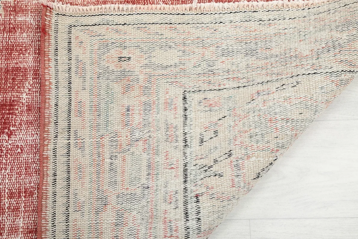 Another view of the rug's reverse side, showing the tight knotting and craftsmanship.