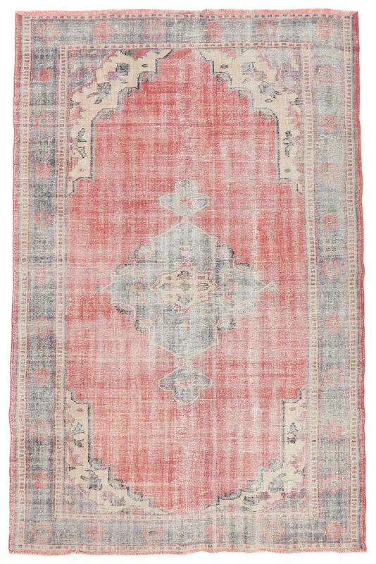 Full overhead view of the vintage rose medallion rug on a white background