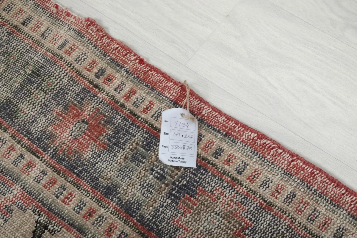 Close-up of the rug's label attached to the back, showing product information