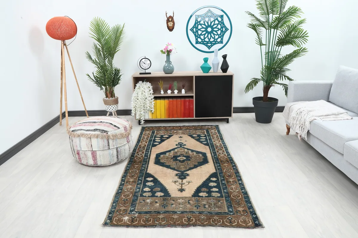 Vintage Anatolian rug displayed in a modern living room setting with a light couch