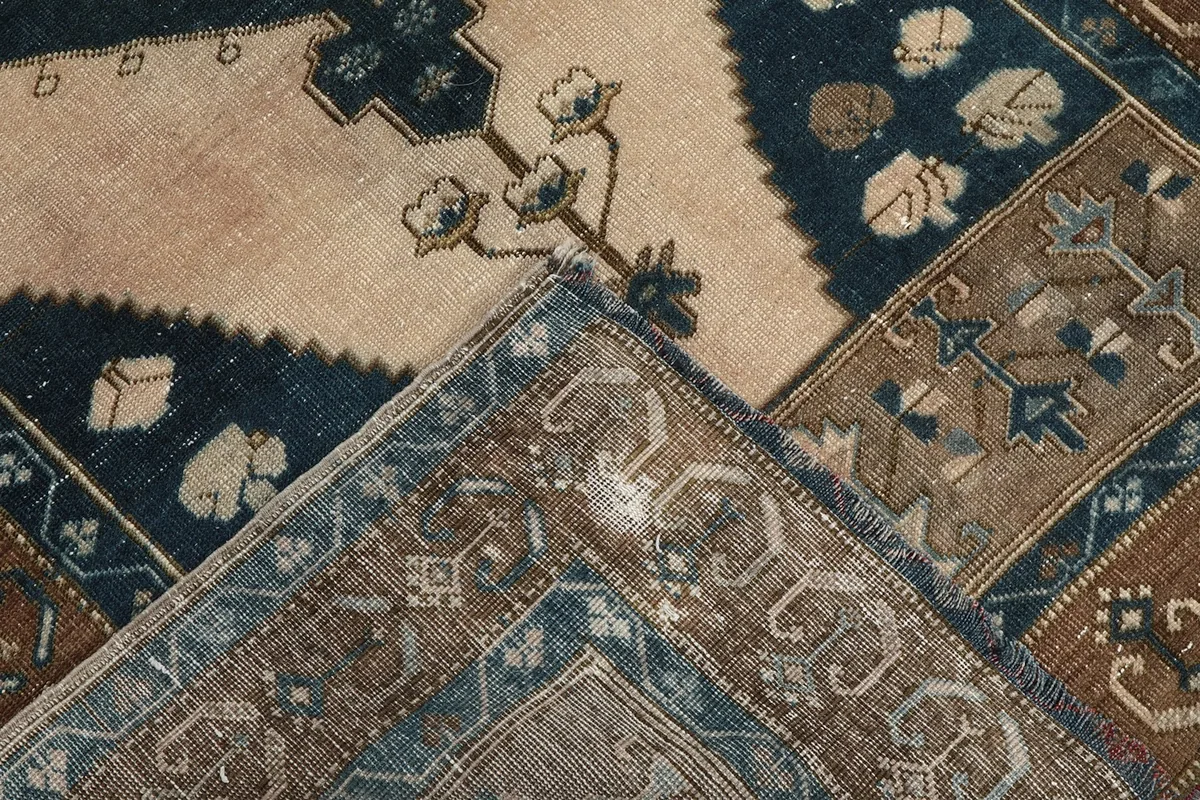 Folded corner detail revealing the hand-knotted construction and pile texture