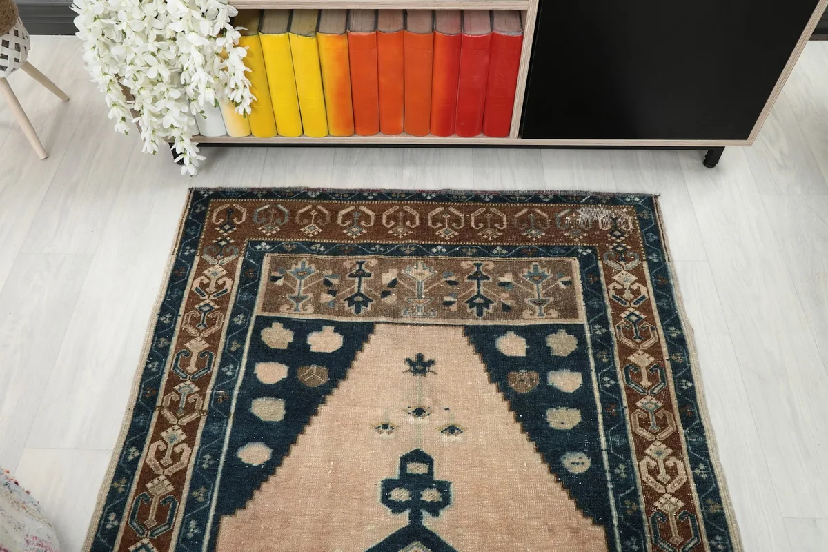 Overhead view showing the top portion of the rug's design and colors