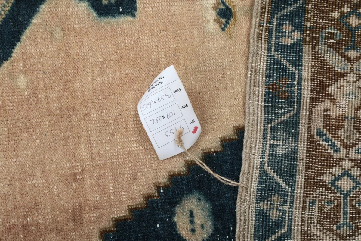 Close-up of the rug's surface with a small product tag attached