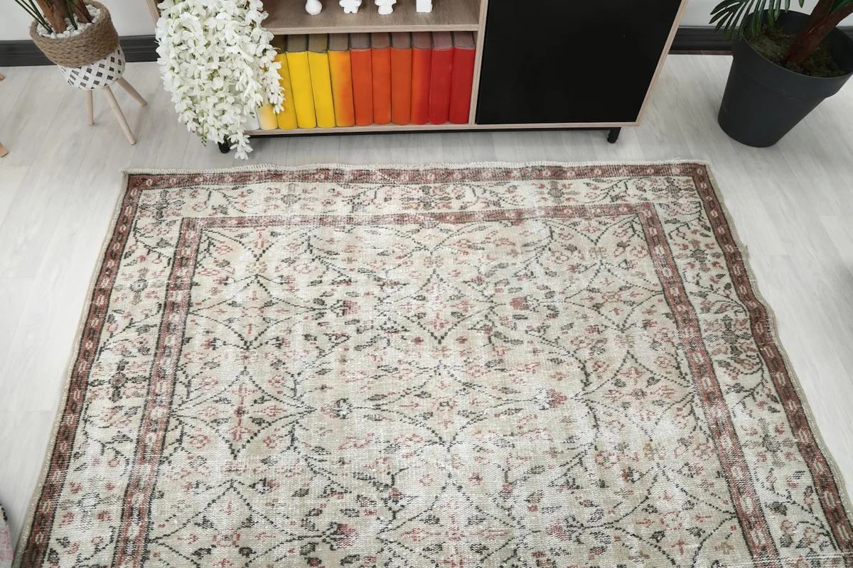 Overhead perspective of the rug in a room, emphasizing its rectangular shape and design