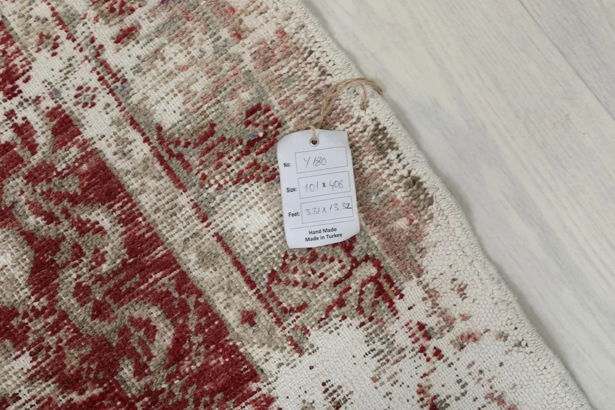 Close-up of the rug's surface with a product tag displaying size and material information