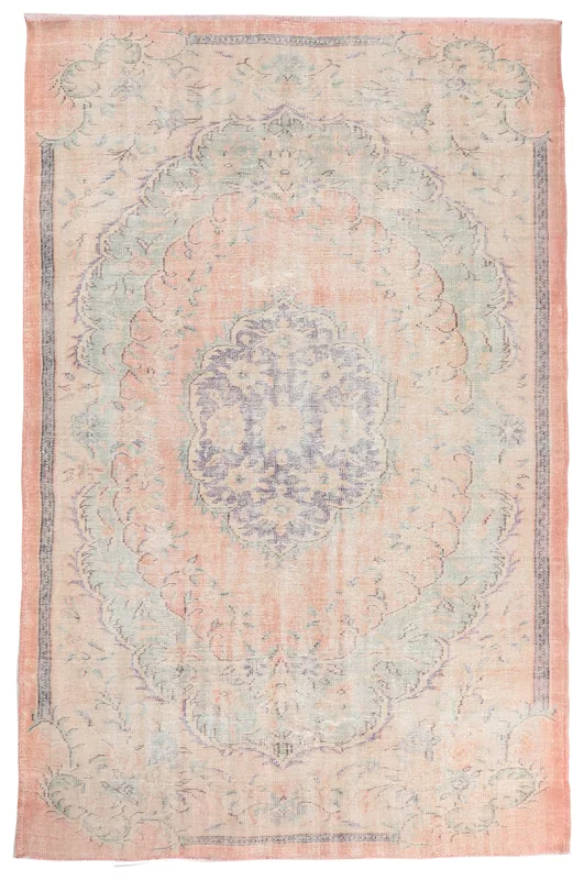 Full top view of the vintage rose gold medallion area rug on a white background