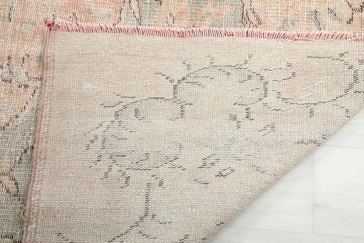 Underside of the hand-knotted rug, revealing the cotton foundation and knotting detail