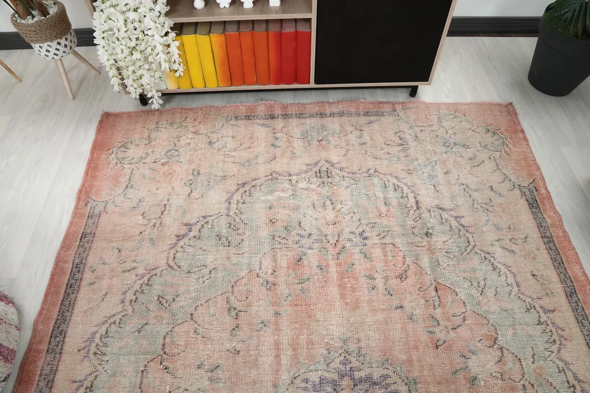 Overhead view of the rug's top half, showing the large medallion and border design