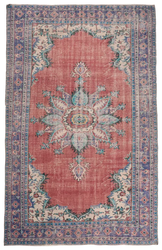 Full overhead view of the rust and blue vintage Anatolian area rug