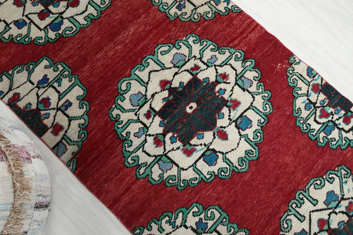 Overhead angle showing the central medallion design and the rug's texture.
