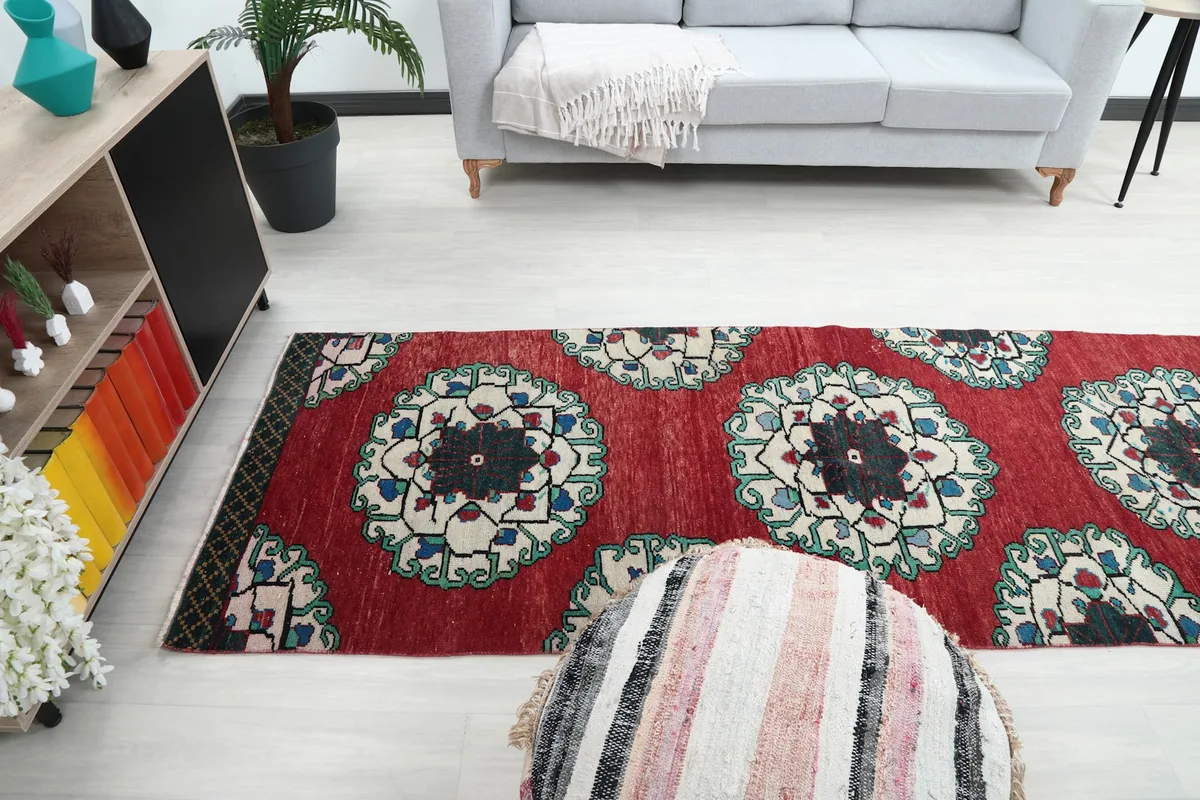 Long view of the runner rug in the room, from a different perspective.