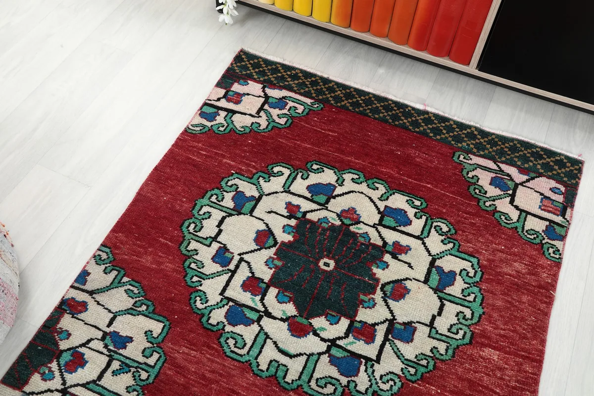 Overhead shot of the rug's end, showing the border and first medallion.