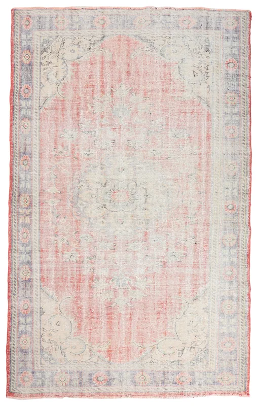 Full overhead view of the rose and ivory vintage Anatolian rug on a white background