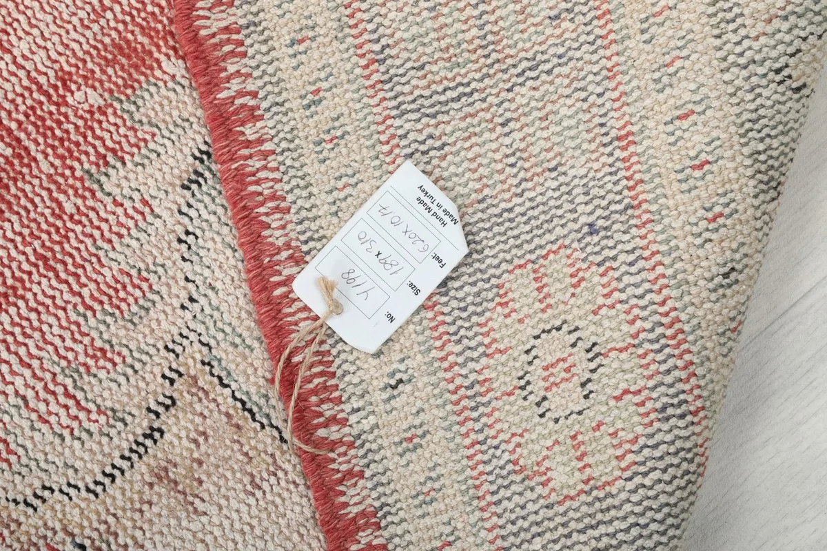 Close-up of the rug's back with a product information tag visible