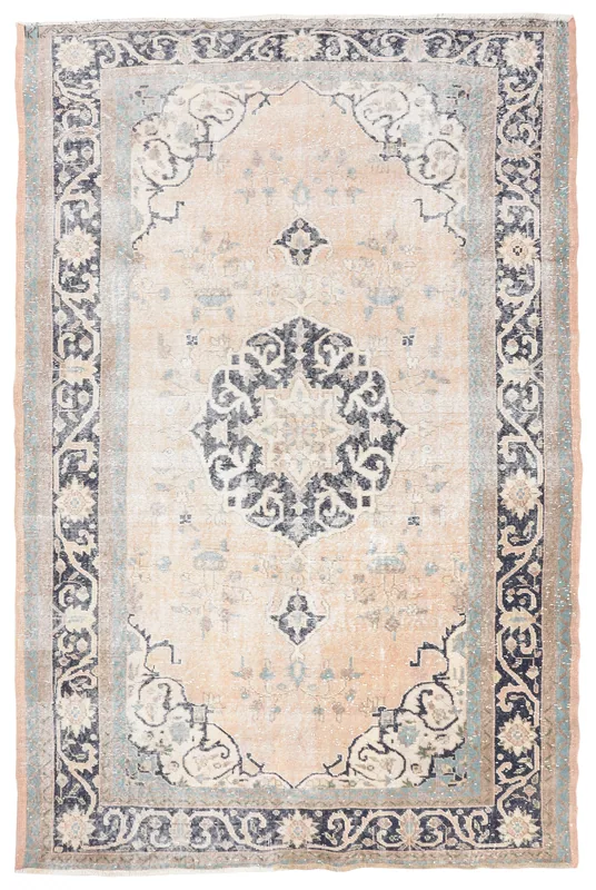 Full top view of the beige and navy medallion vintage Anatolian area rug