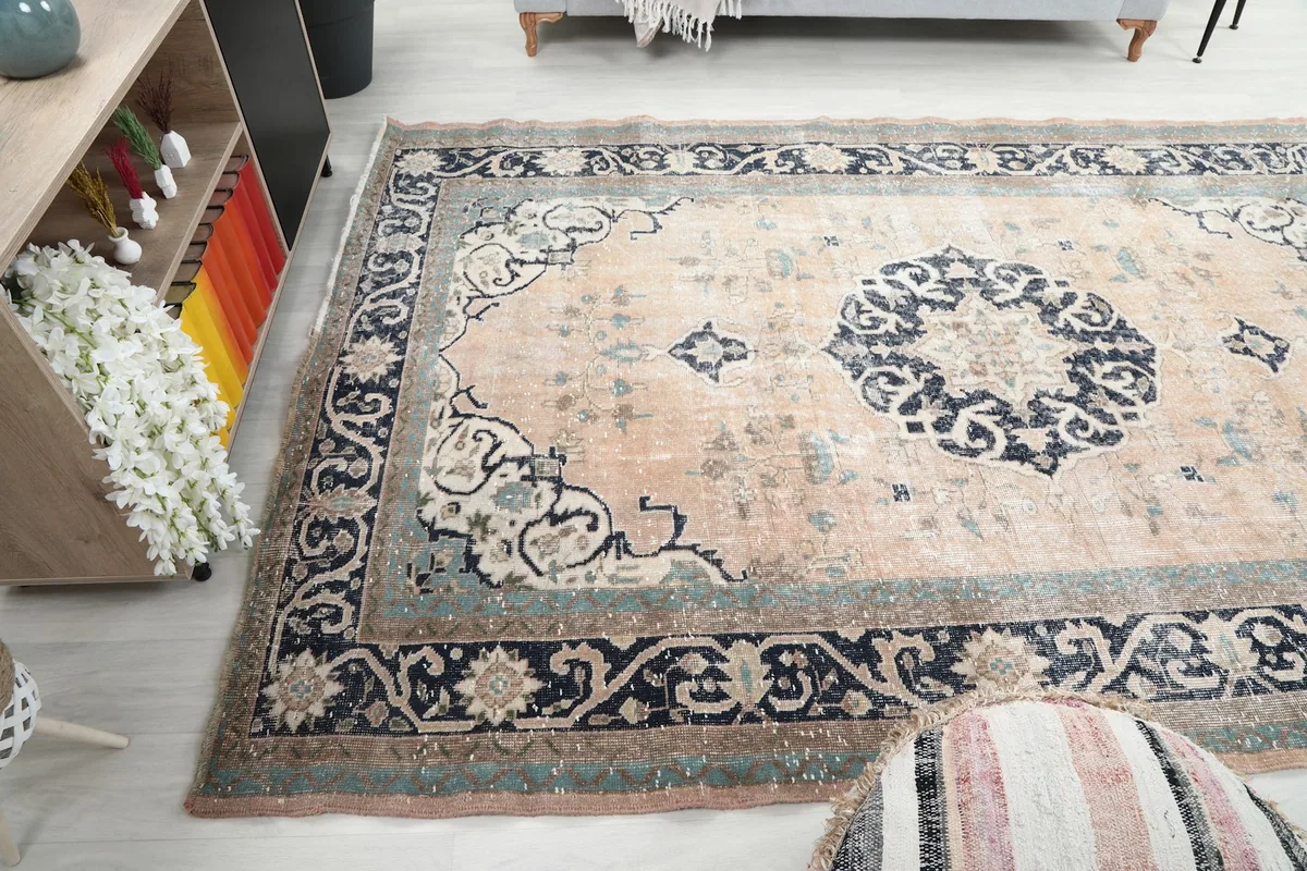 Wide angled view of the rug in a room, showing its full presence and color palette