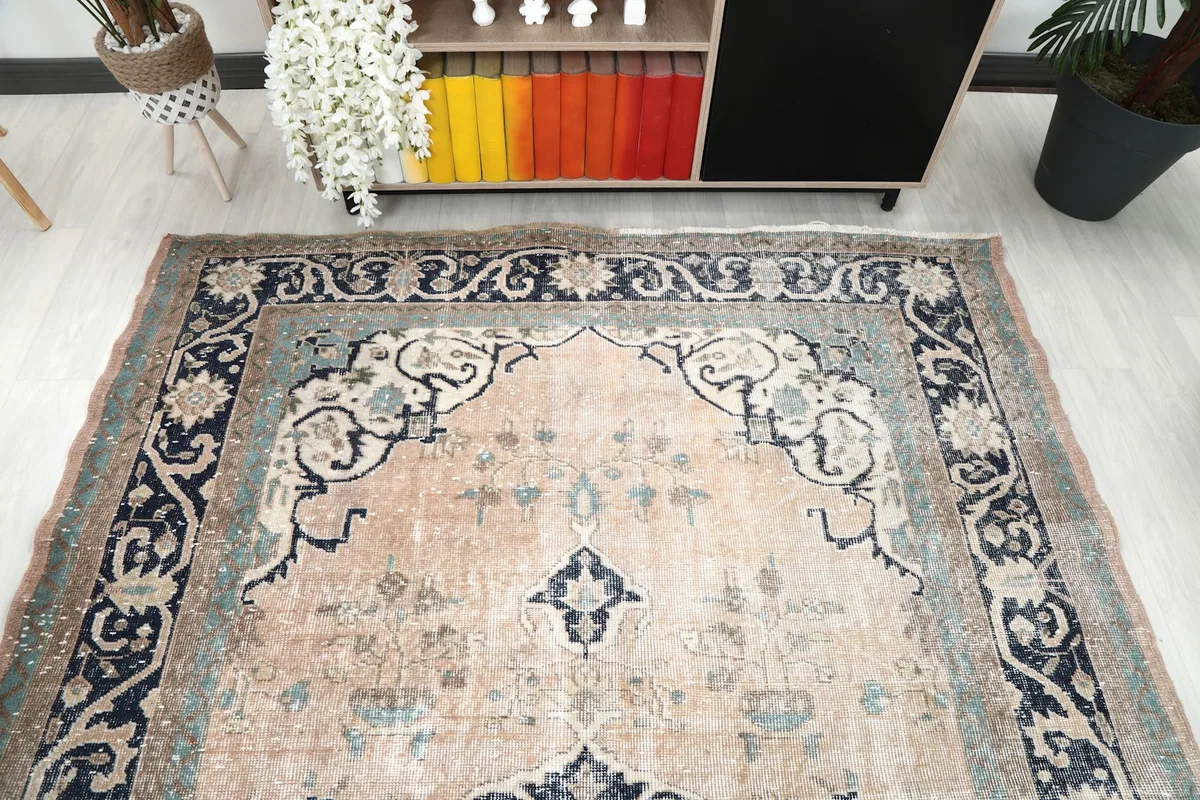 Overhead perspective of the rug, emphasizing the main medallion and corner motifs