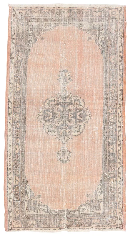 Full top view of the vintage rose and gray Anatolian area rug on a white background