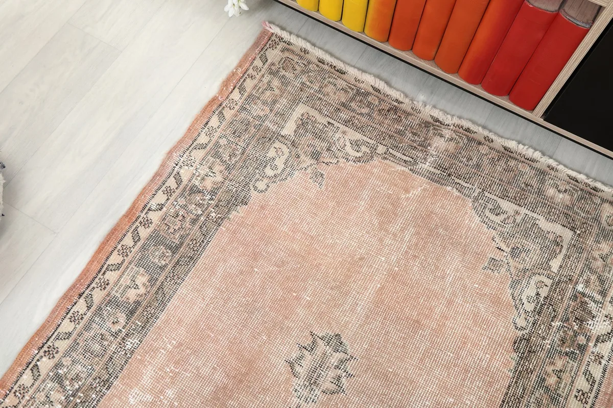 Angle view highlighting the top section of the rug, showing the border and field colors